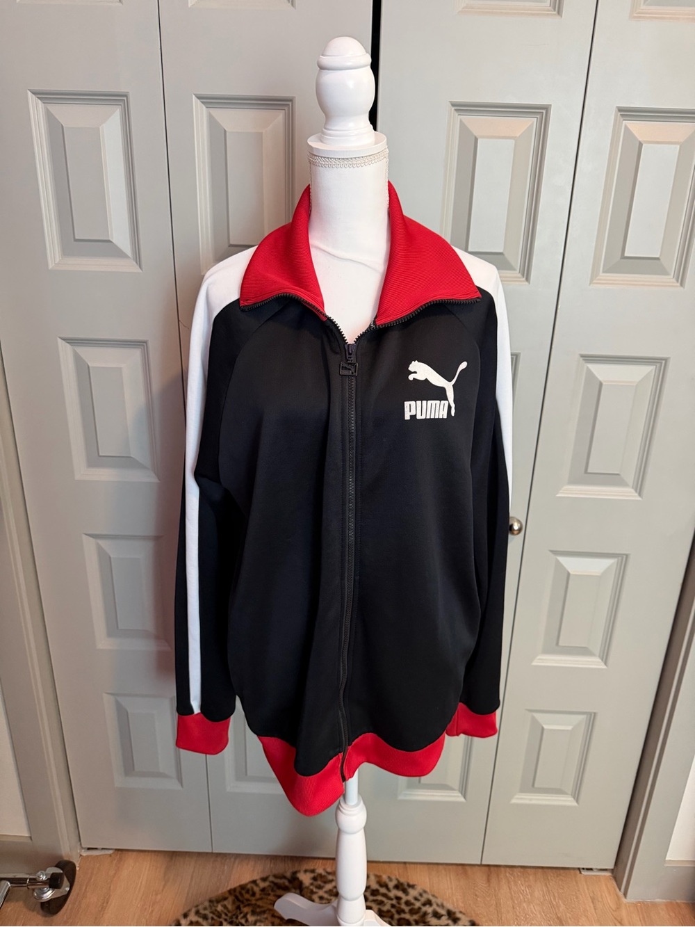 Puma Black Jacket with Red Accents and White Stripes